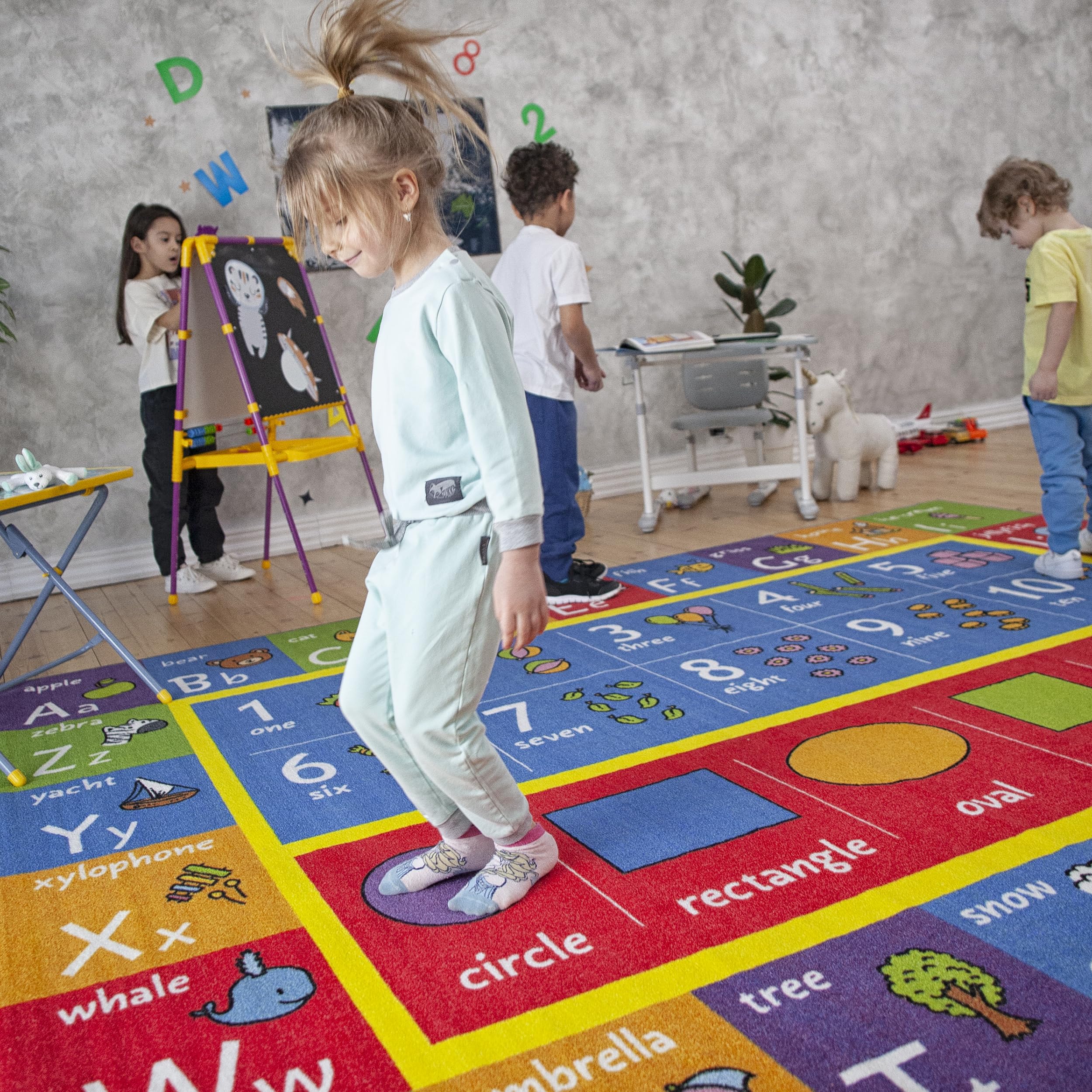 KC Cubs Colorful Patterns Rug invites imaginative play and early math discovery.