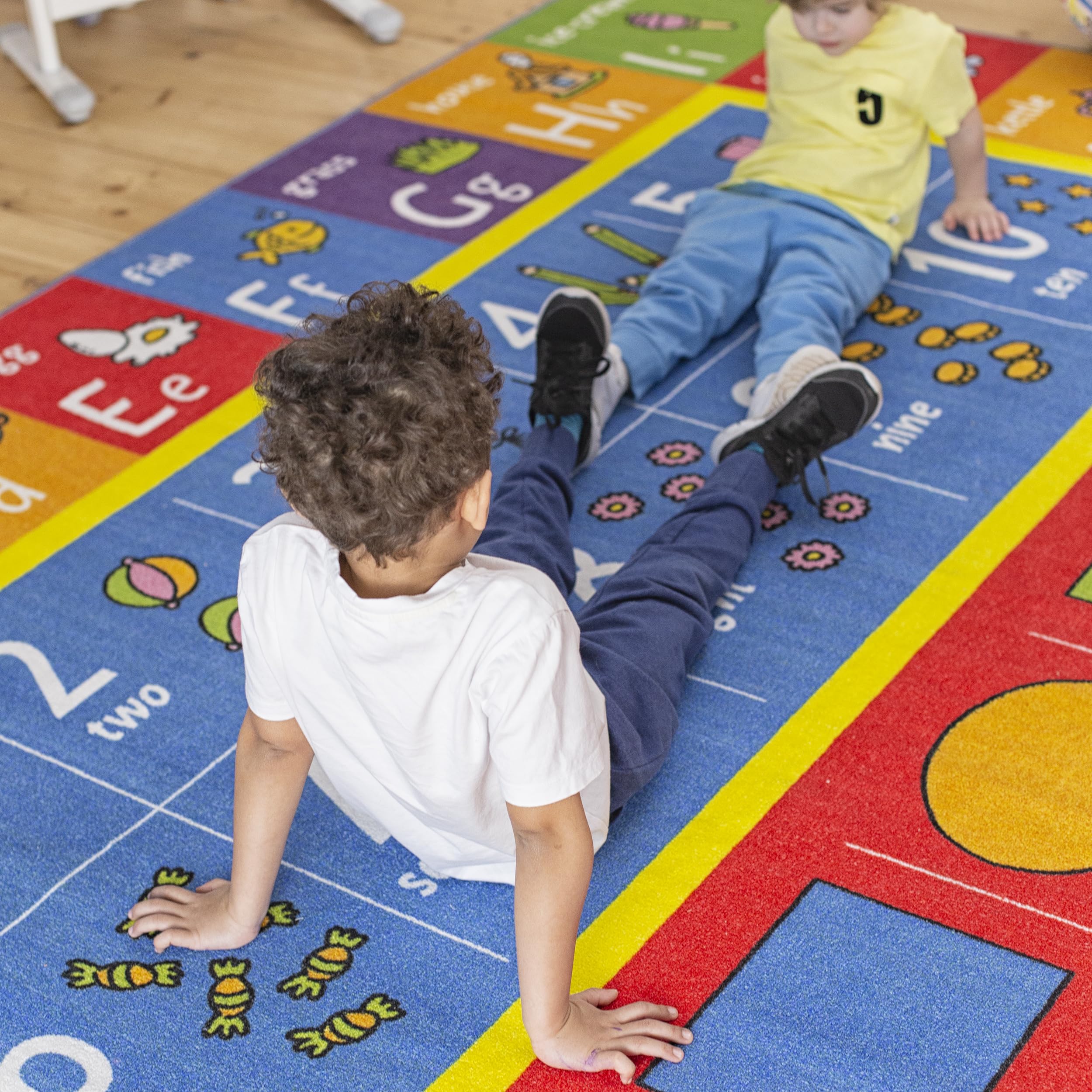 KC Cubs rug helps shapes recognition through colorful illustrations during interactive activities.