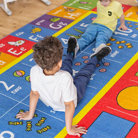 KC Cubs rug helps shapes recognition through colorful illustrations during interactive activities.