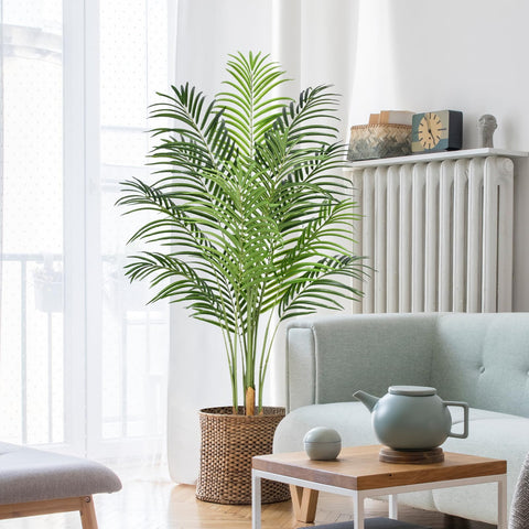 Keeplush 5ft artificial palm tree indoors with lush leaves for maintenance-free tropical vibe.