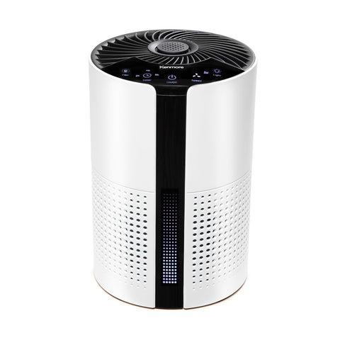 Kenmore PM1010 air purifier in a bedroom improving air quality for restful sleep.
