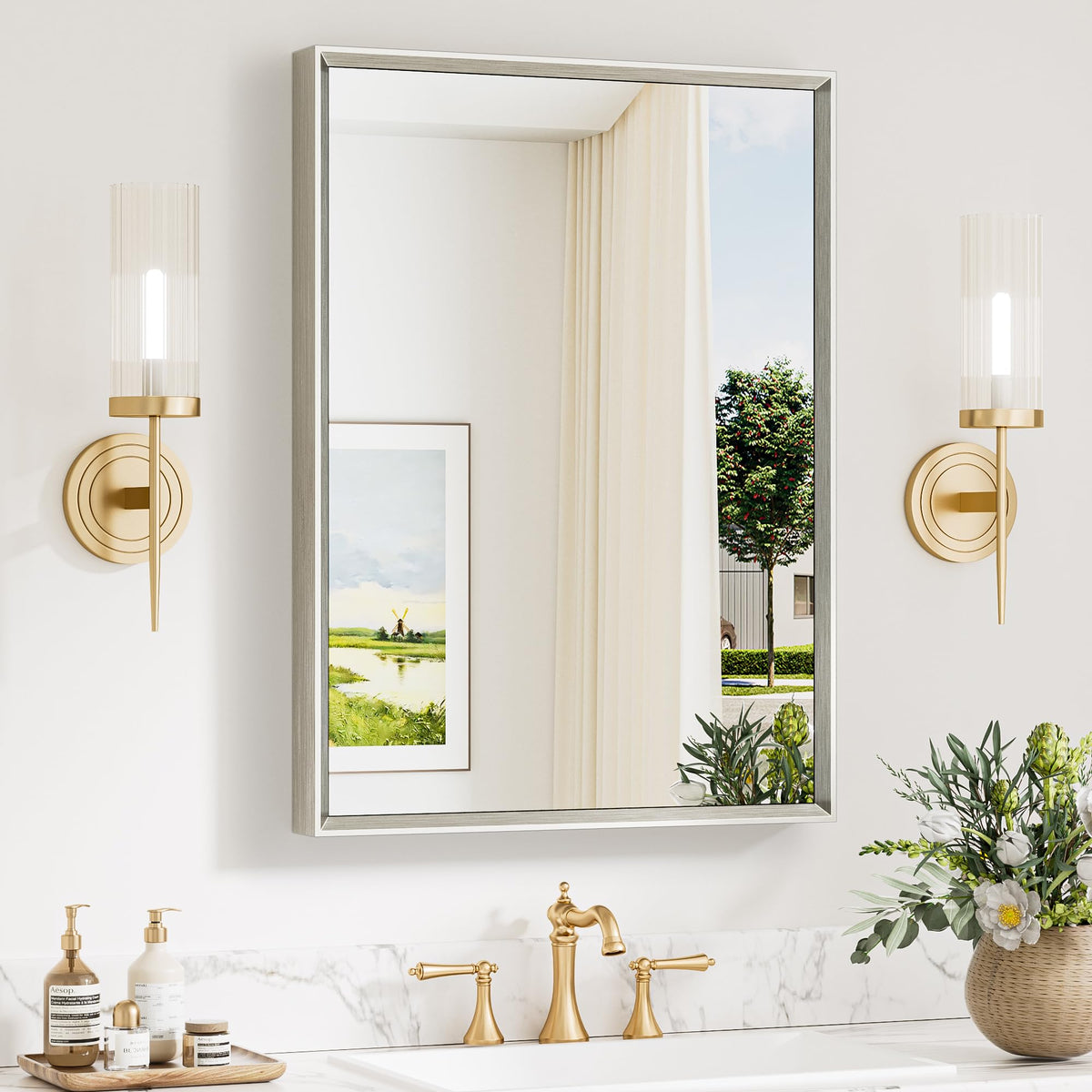 Keonjinn brushed nickel mirror over sink with beveled edge for daily grooming.