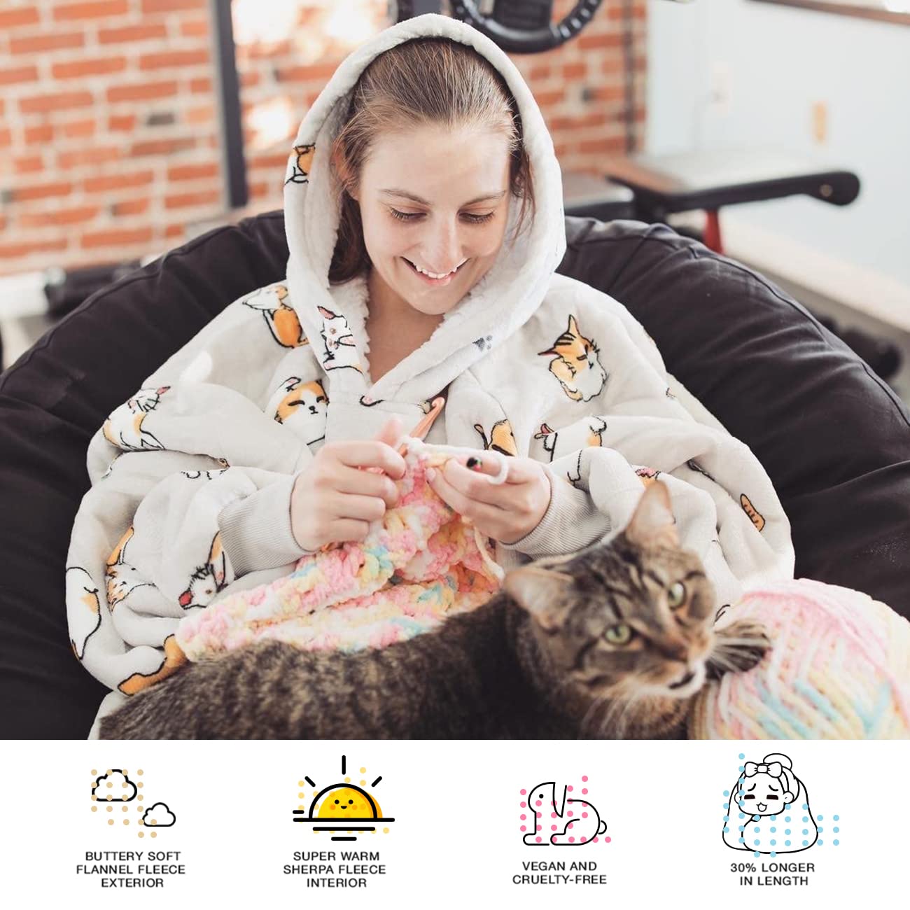 KFUBUO oversized hoodie blanket draped on couch for TV time.