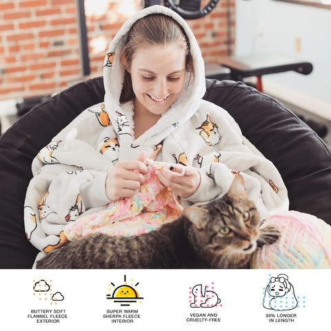 KFUBUO oversized hoodie blanket draped on couch for TV time.