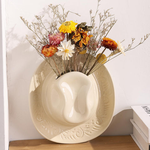 KGCCIZI Wall-mounted vase adds compact greenery to hallway decor.