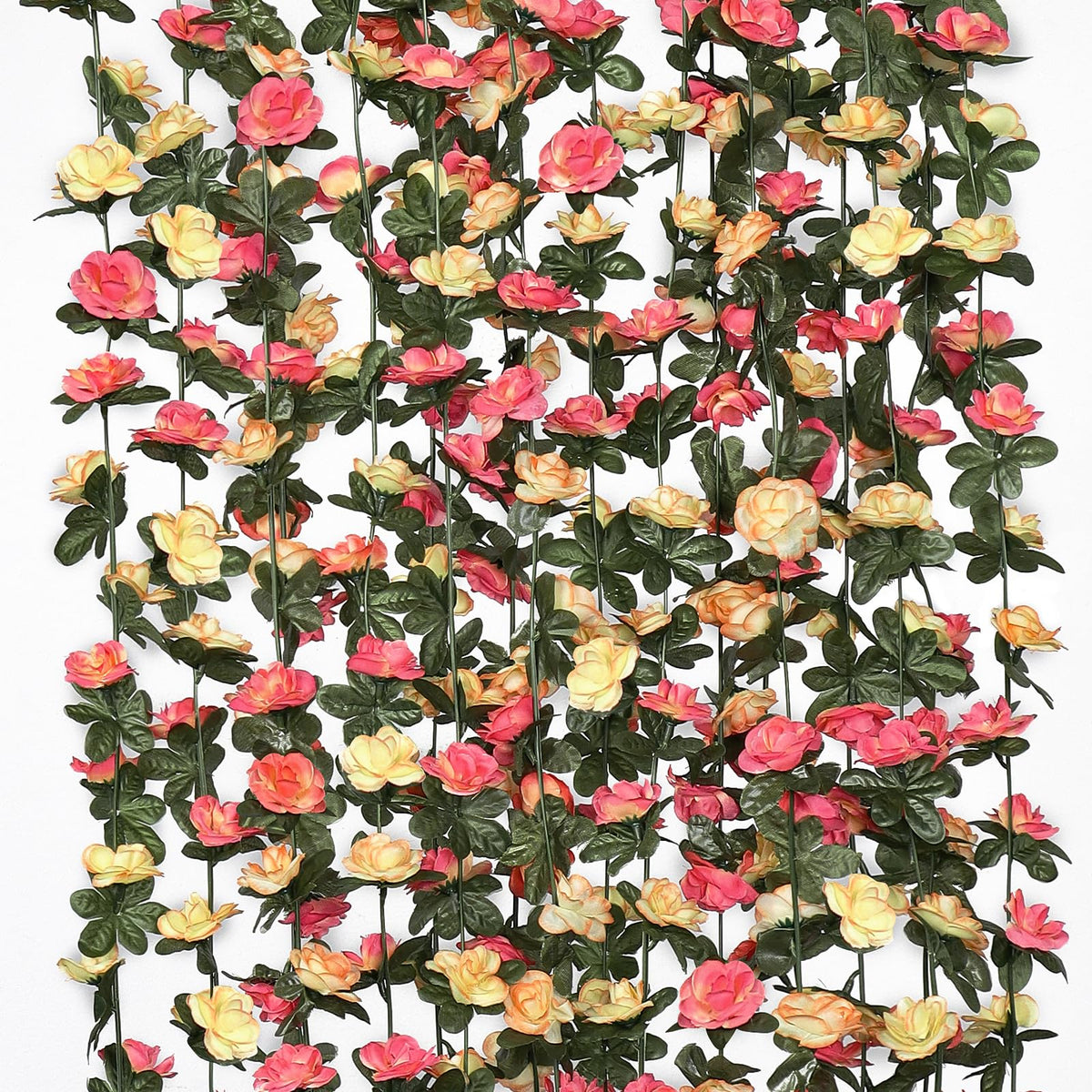 Khoyime champagne rose garland draped on an outdoor arch for a romantic wedding backdrop.