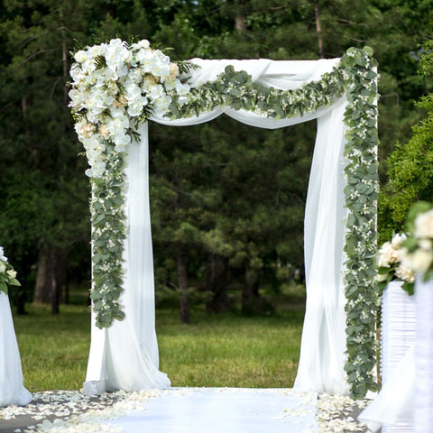 Khoyime garland with white flowers for romantic tablescapes and events.