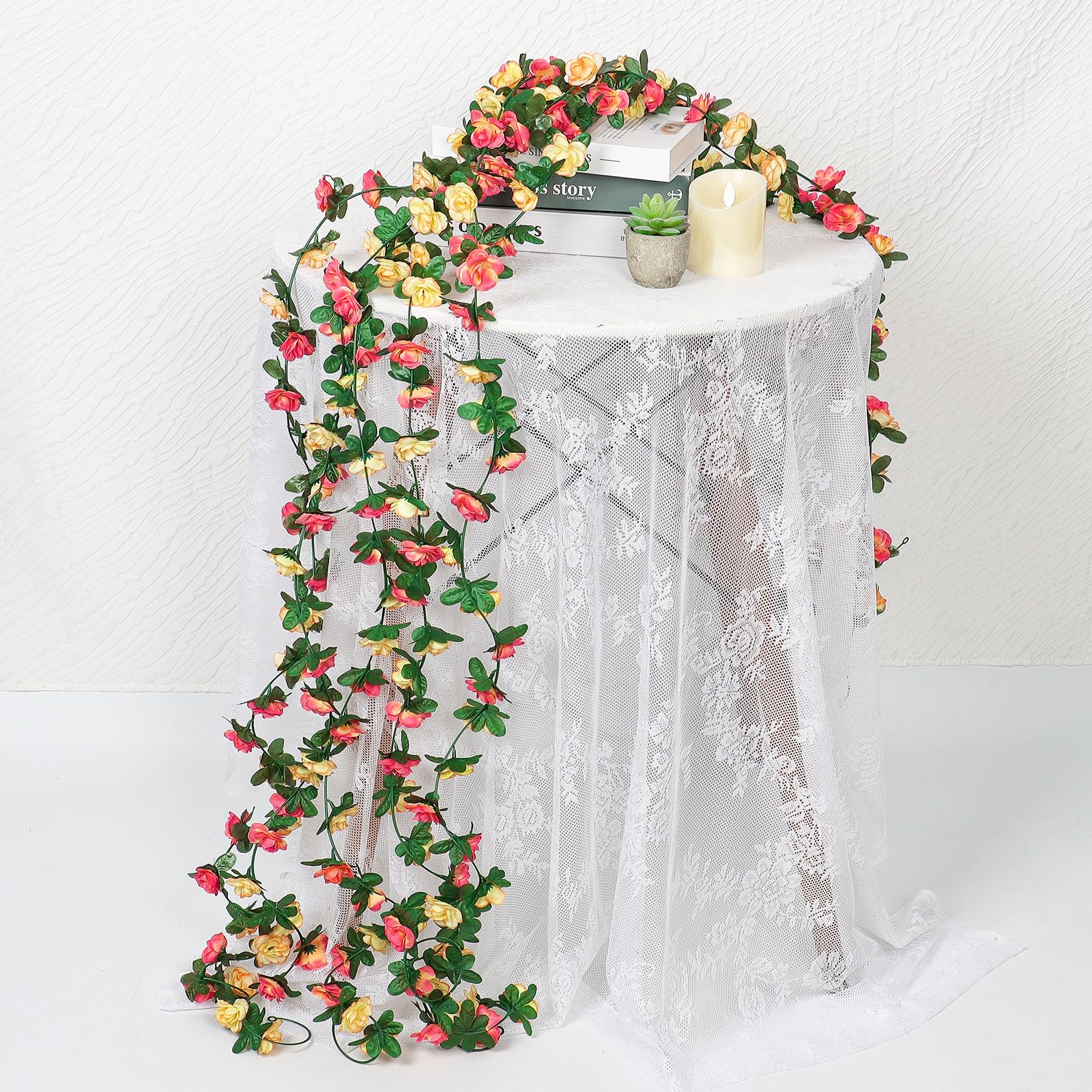 Khoyime rose garland decorating dining table for festive dinner settings.