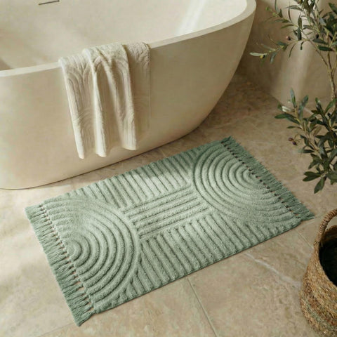 KIBAGA boho tassel rug in bathroom with non-slip bottom for safe everyday footing