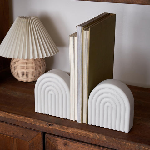 KIBAGA bookend measures 5.5 x 5 x 1.8 inches for most shelves.