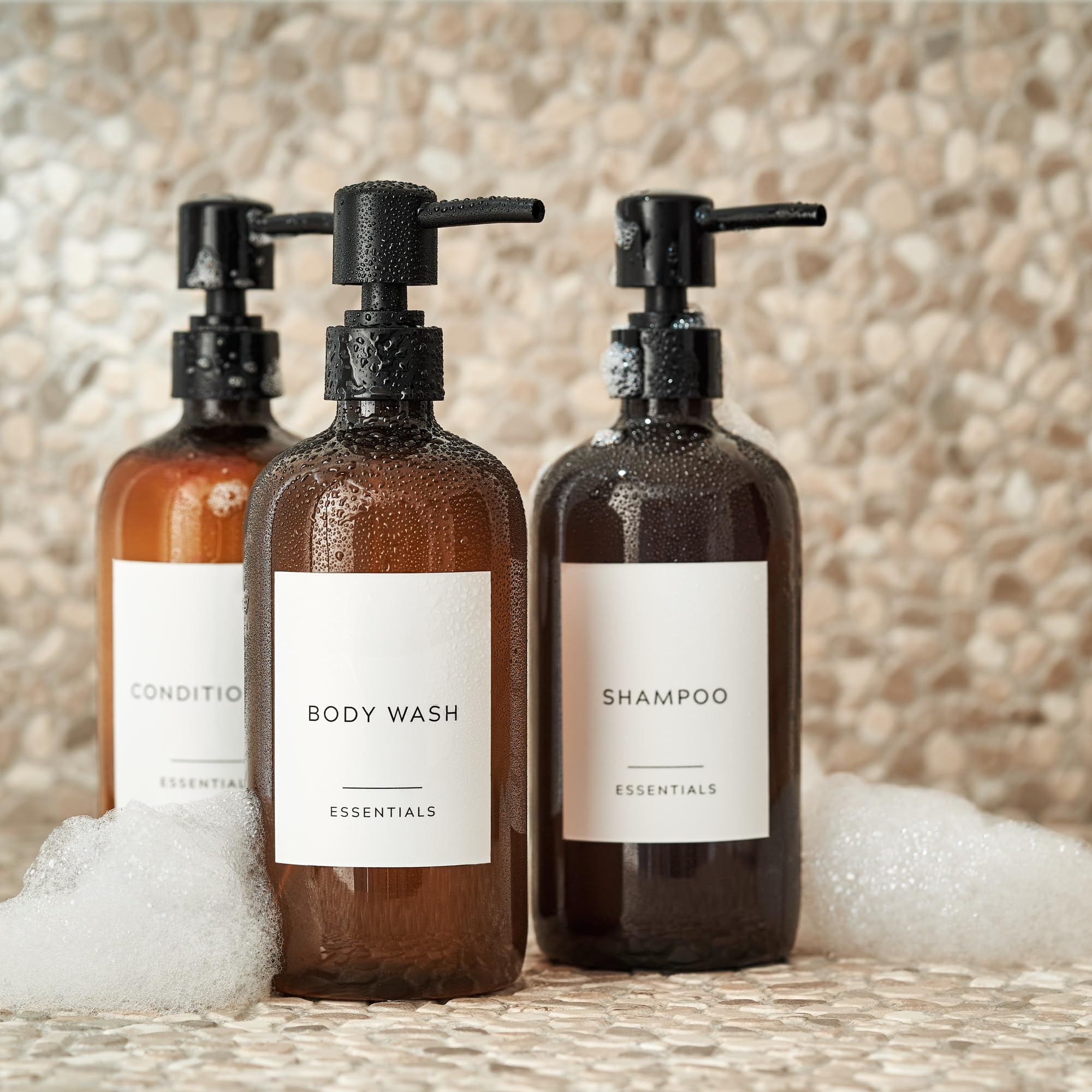 KIBAGA conditioner dispenser 21oz bottle shown beside glass bathroom decor.