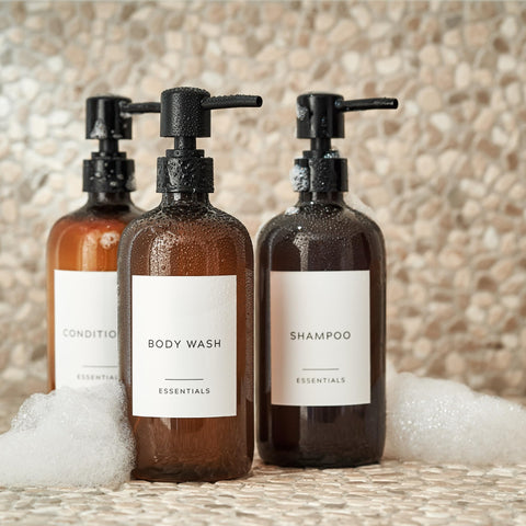 KIBAGA conditioner dispenser 21oz bottle shown beside glass bathroom decor.