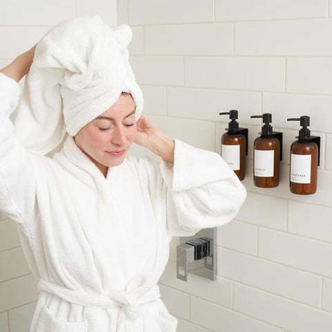 KIBAGA wall-mounted body wash dispenser 21oz keeps showers neat.
