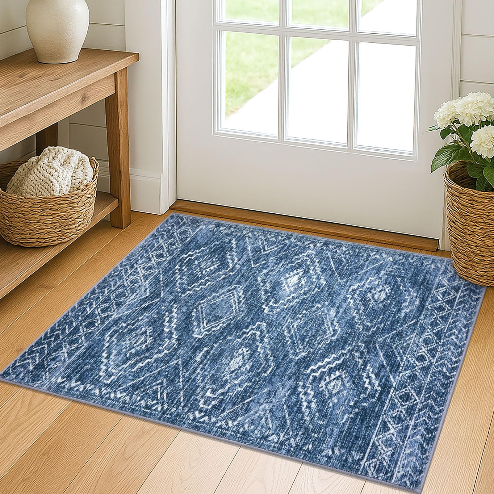 KILOCOCO entryway rug 2x3 with blue geometric design catches dirt at door.