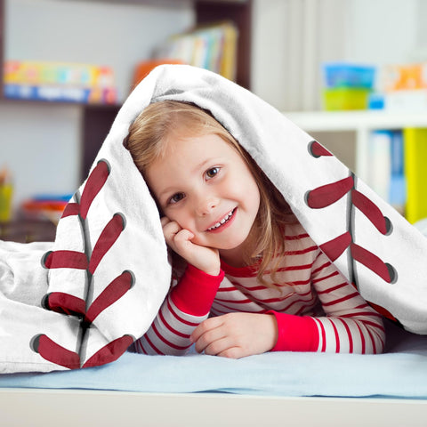 King DARE baseball blanket on bed offers soft comfort at night.