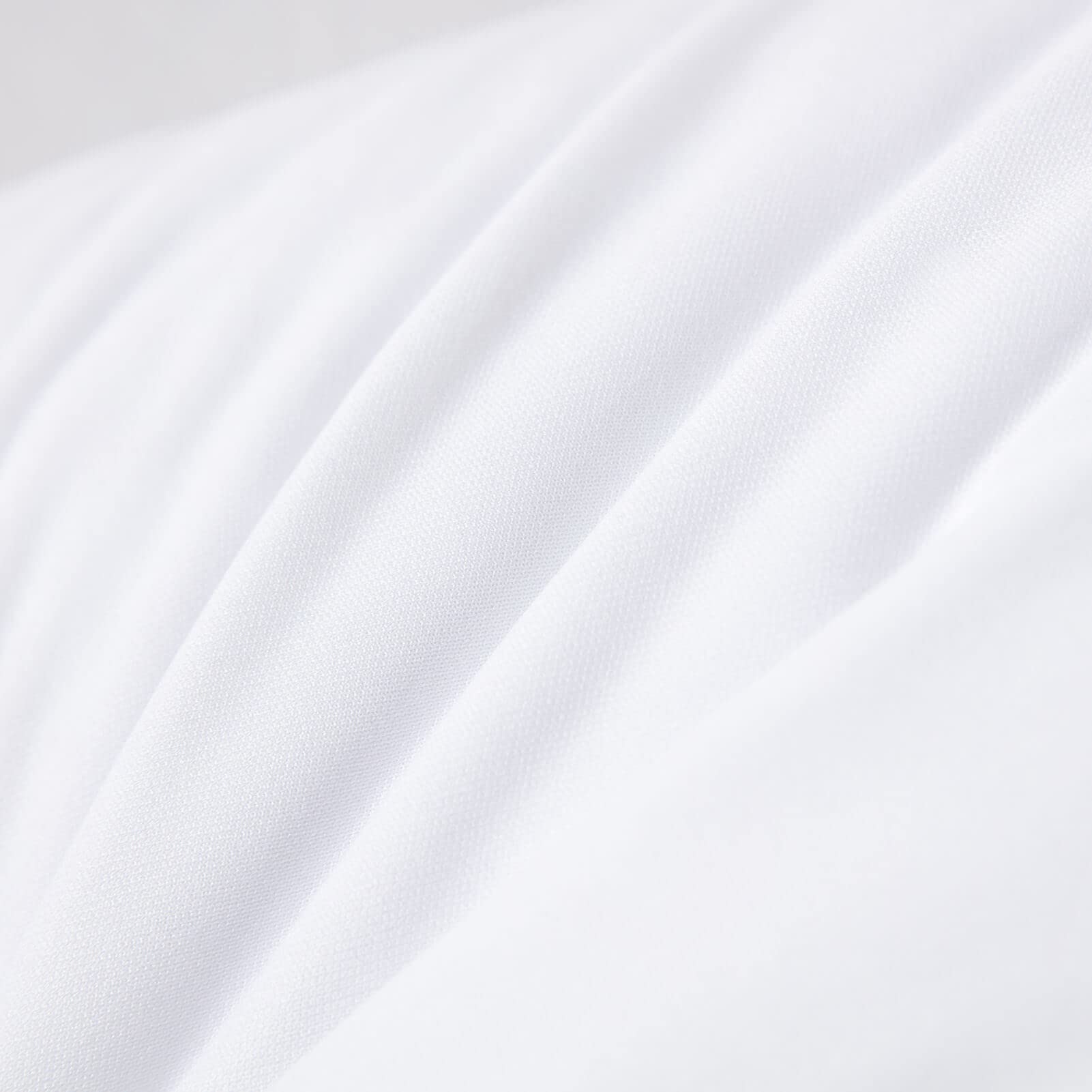 Kingnex poke-proof pillow cover reduces feather migration for tidy cushions
