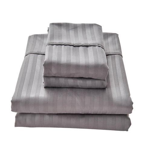 Kingnex flat sheet draped over a queen sleeper sofa for full coverage