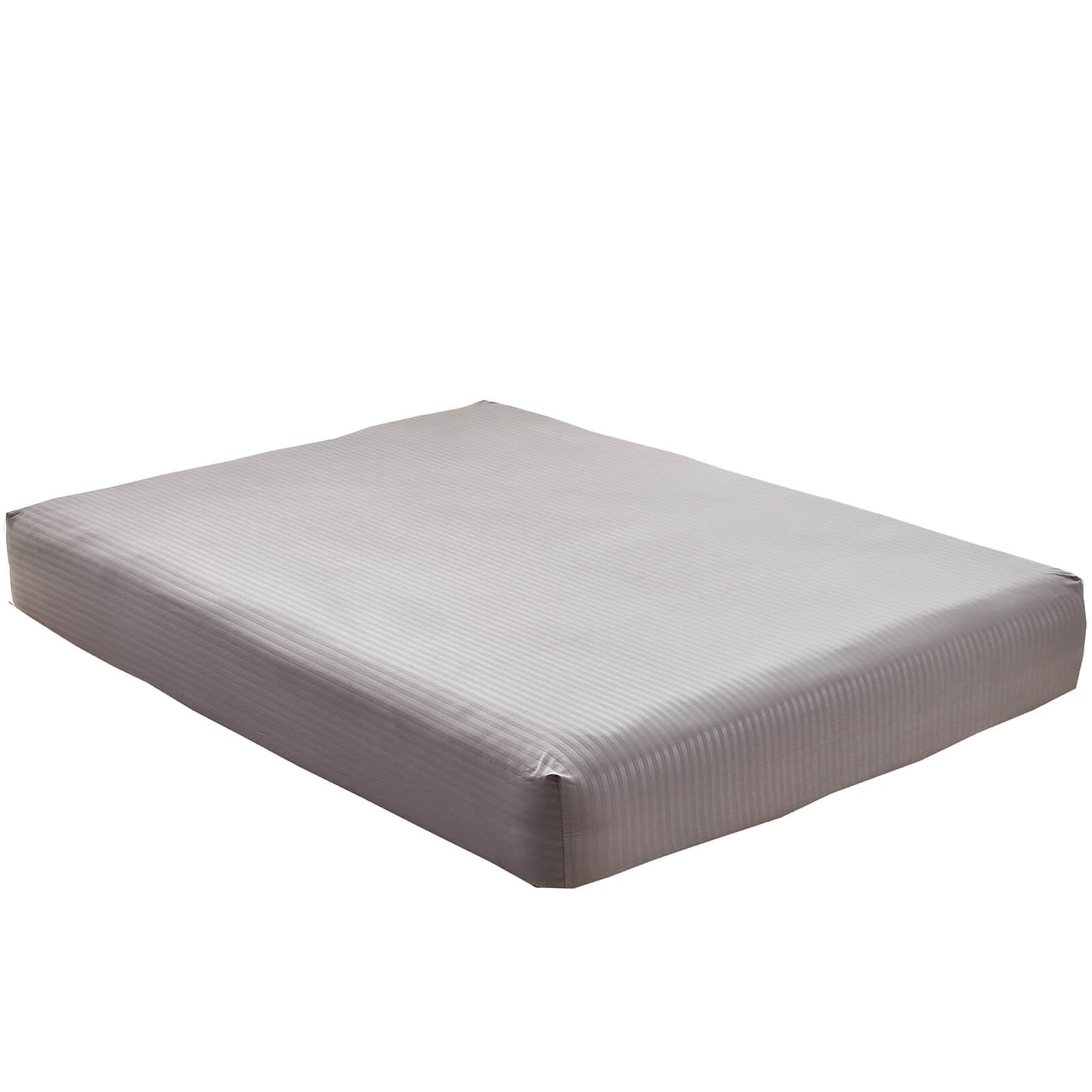 Grey striped Kingnex bedding on a modern sleeper sofa