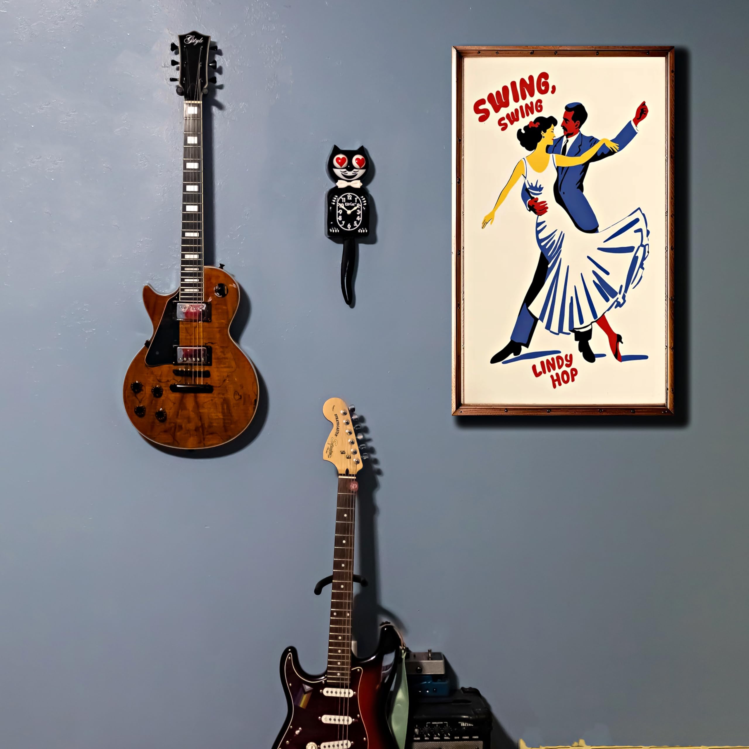 Kit Cat Klock classic black wall display enhances retro decor.