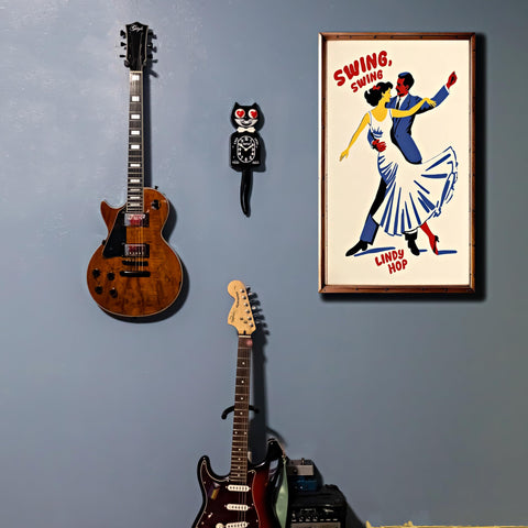 Kit Cat Klock classic black wall display enhances retro decor.