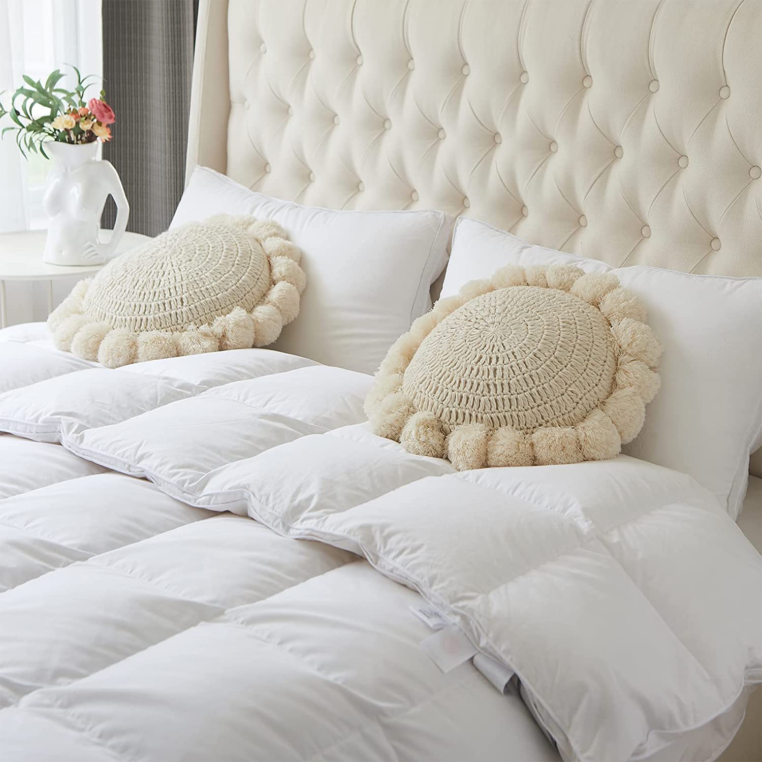 kitletsuit pom poms fringes add playful detail to cushions and throws.