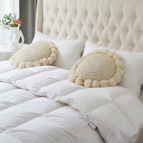 kitletsuit pom poms fringes add playful detail to cushions and throws.