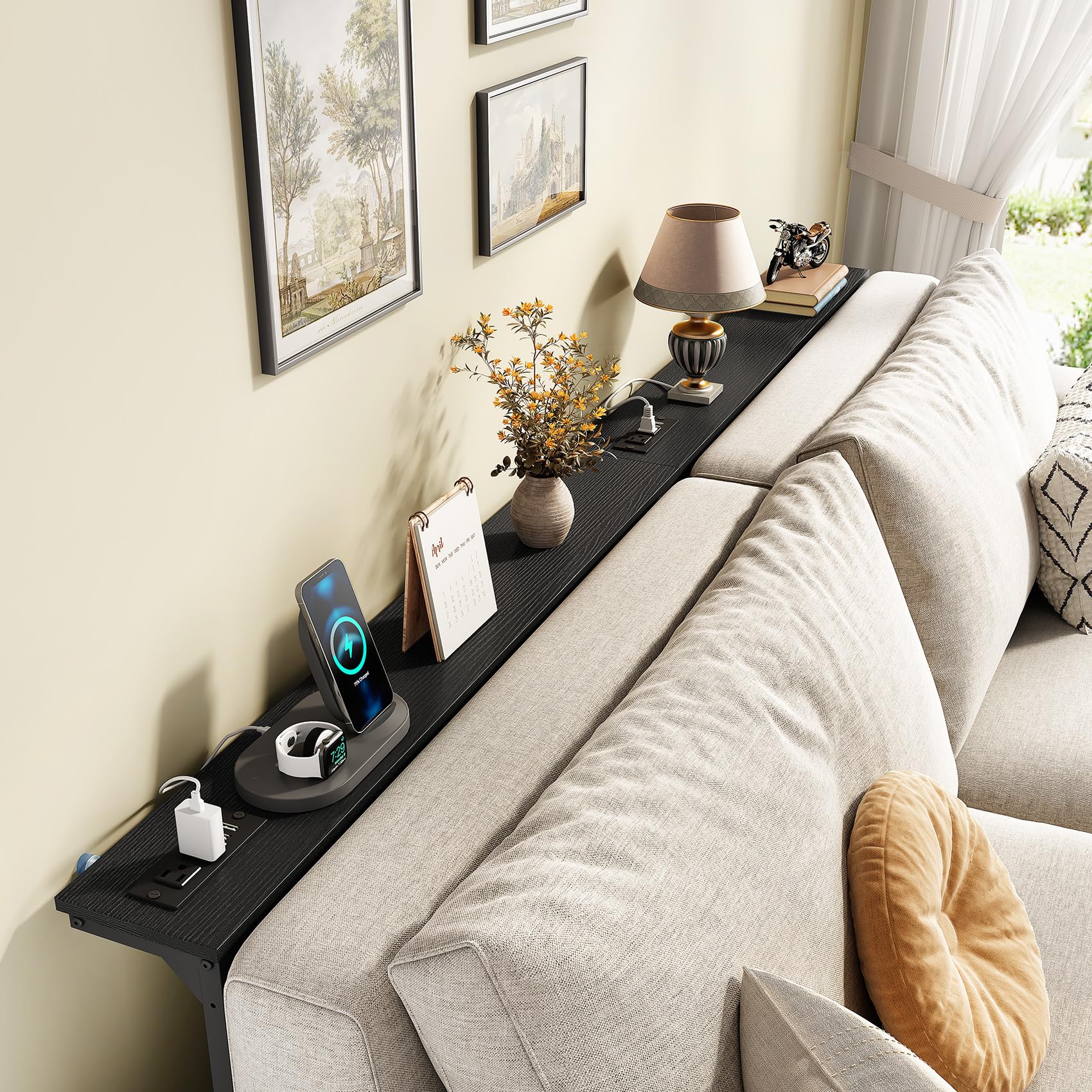 Kitstorack adjustable-height console adapts to sofa height for comfortable use.