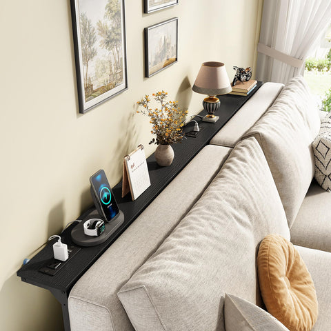 Kitstorack adjustable-height console adapts to sofa height for comfortable use.