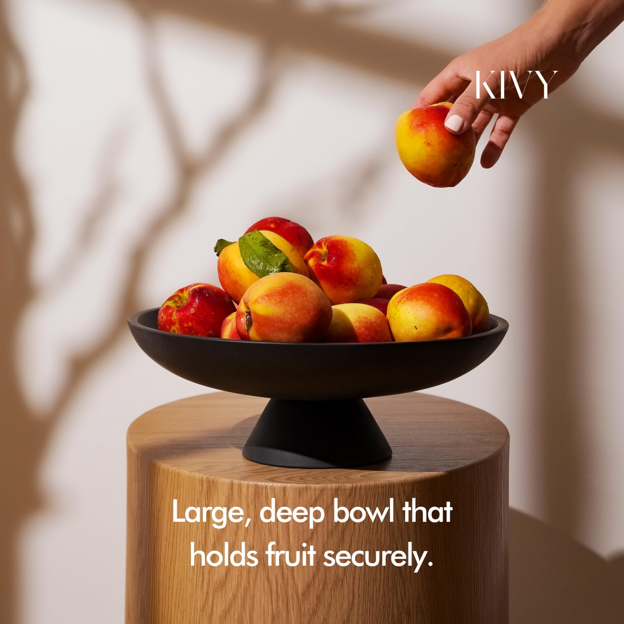 KIVY concrete fruit bowl on counter, showcasing large capacity for fresh fruit storage.