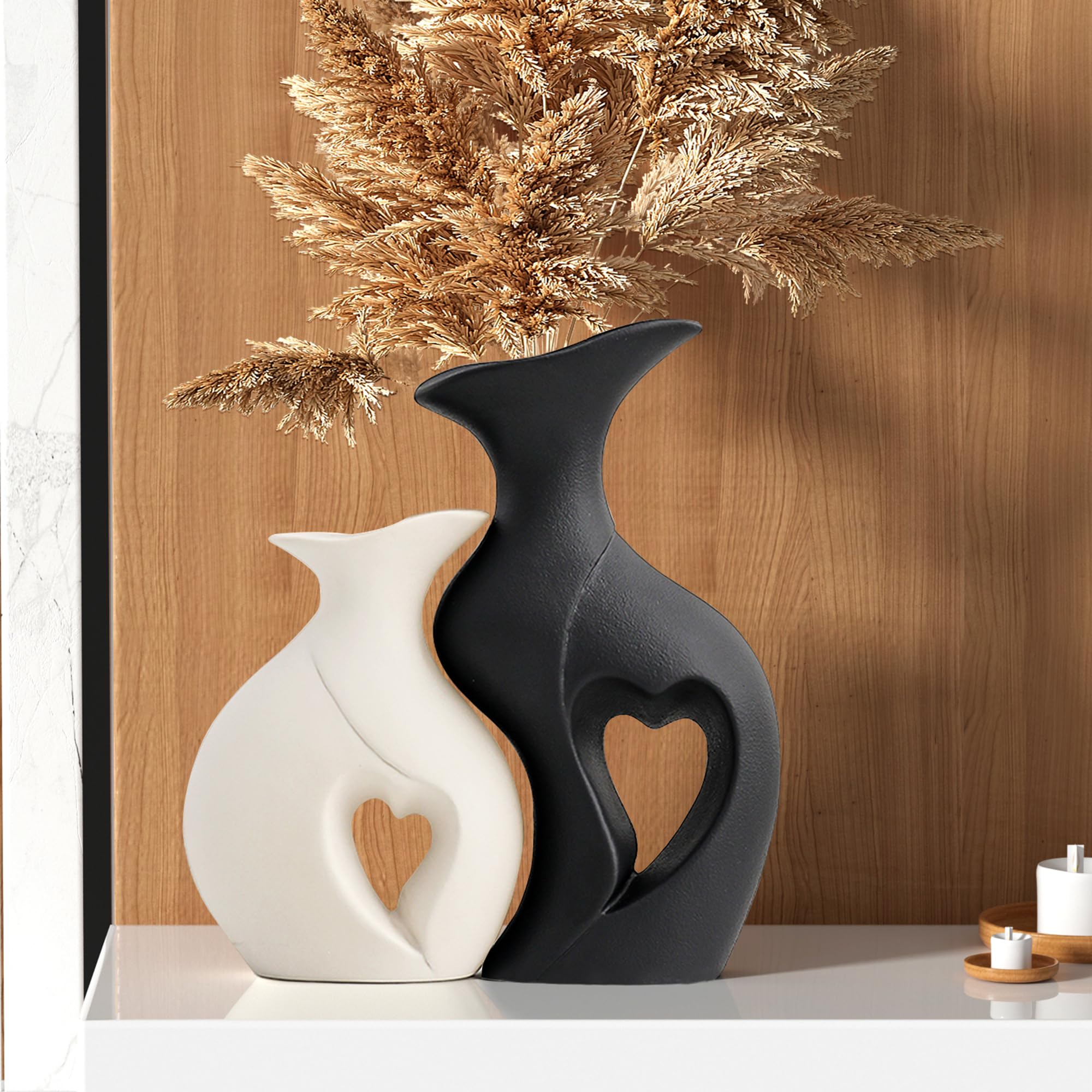KKgoubz black and white heart vase set 2 on shelf adds contemporary contrast.
