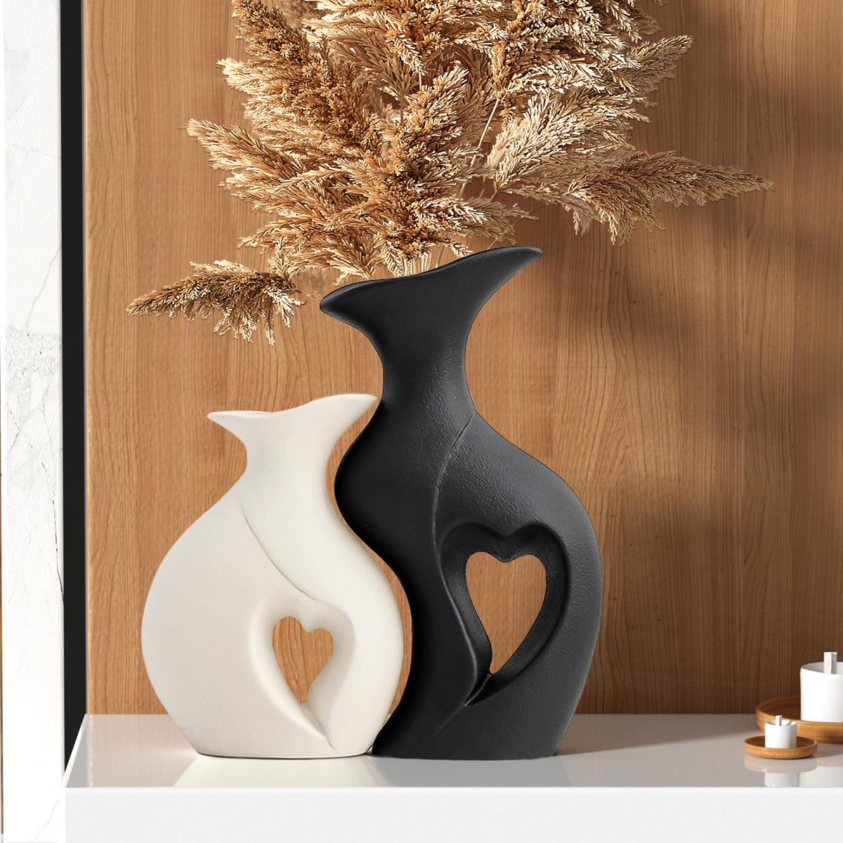 KKgoubz black and white heart vase set 2 on shelf adds contemporary contrast.