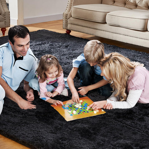 KNZE rug shows non-slip dots for secure placement on floors.