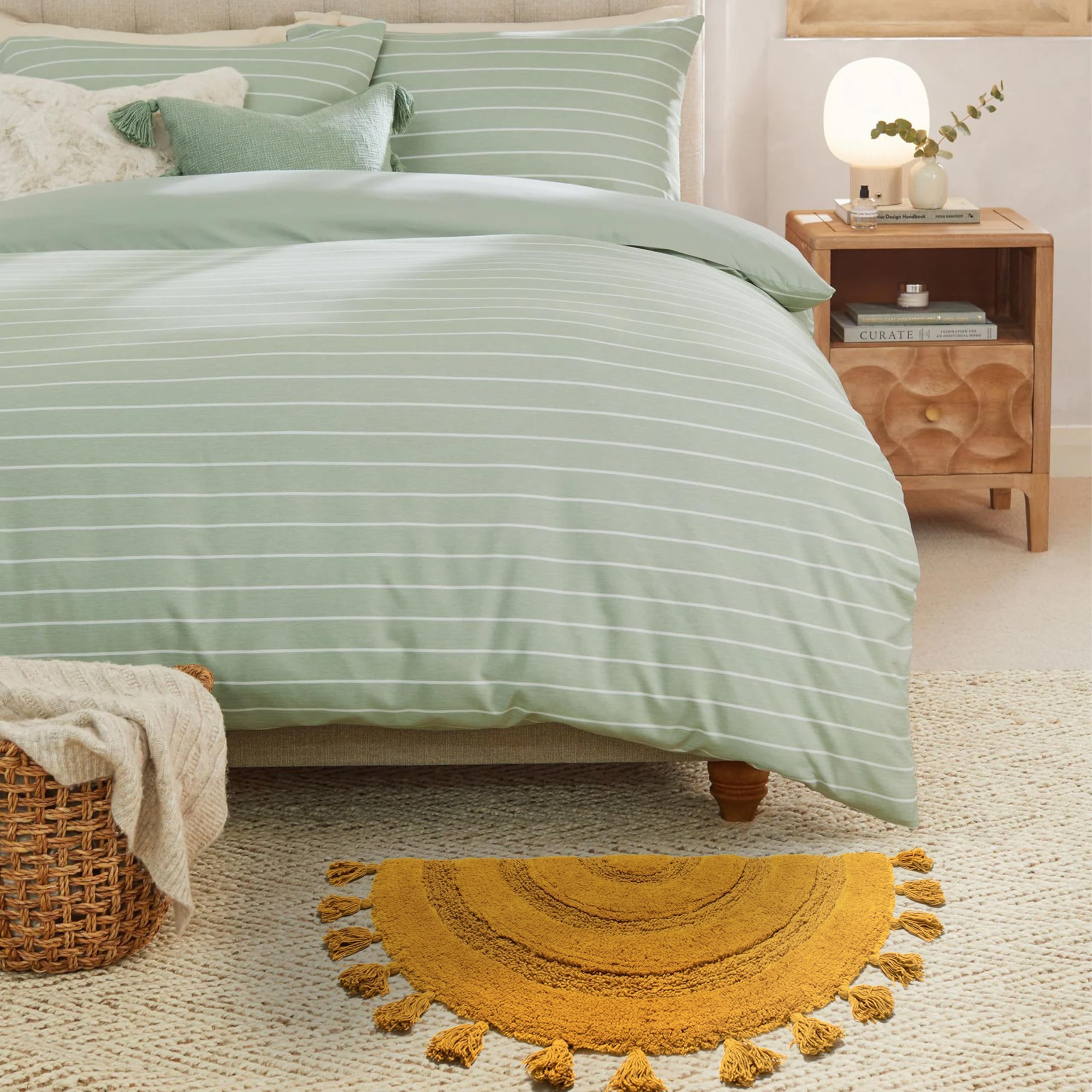 KOEXM nursery-friendly rug adds soft comfort to little feet.