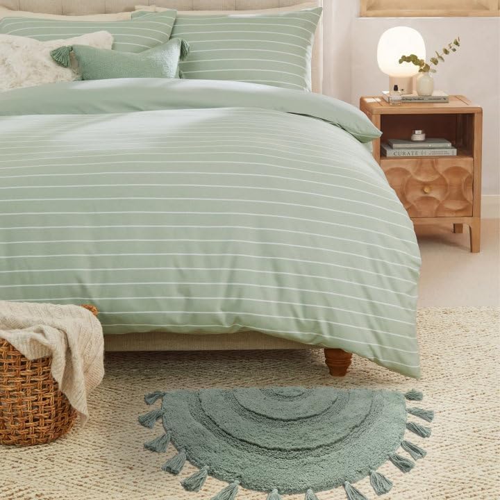 KOEXM half-circle boho rug enhances home ambience with warm vintage charm.