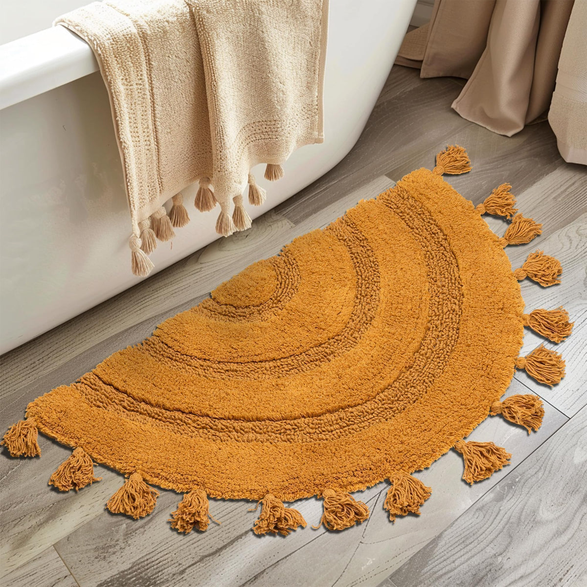 KOEXM half circle boho rug with tassels creates cozy bathroom ambiance.