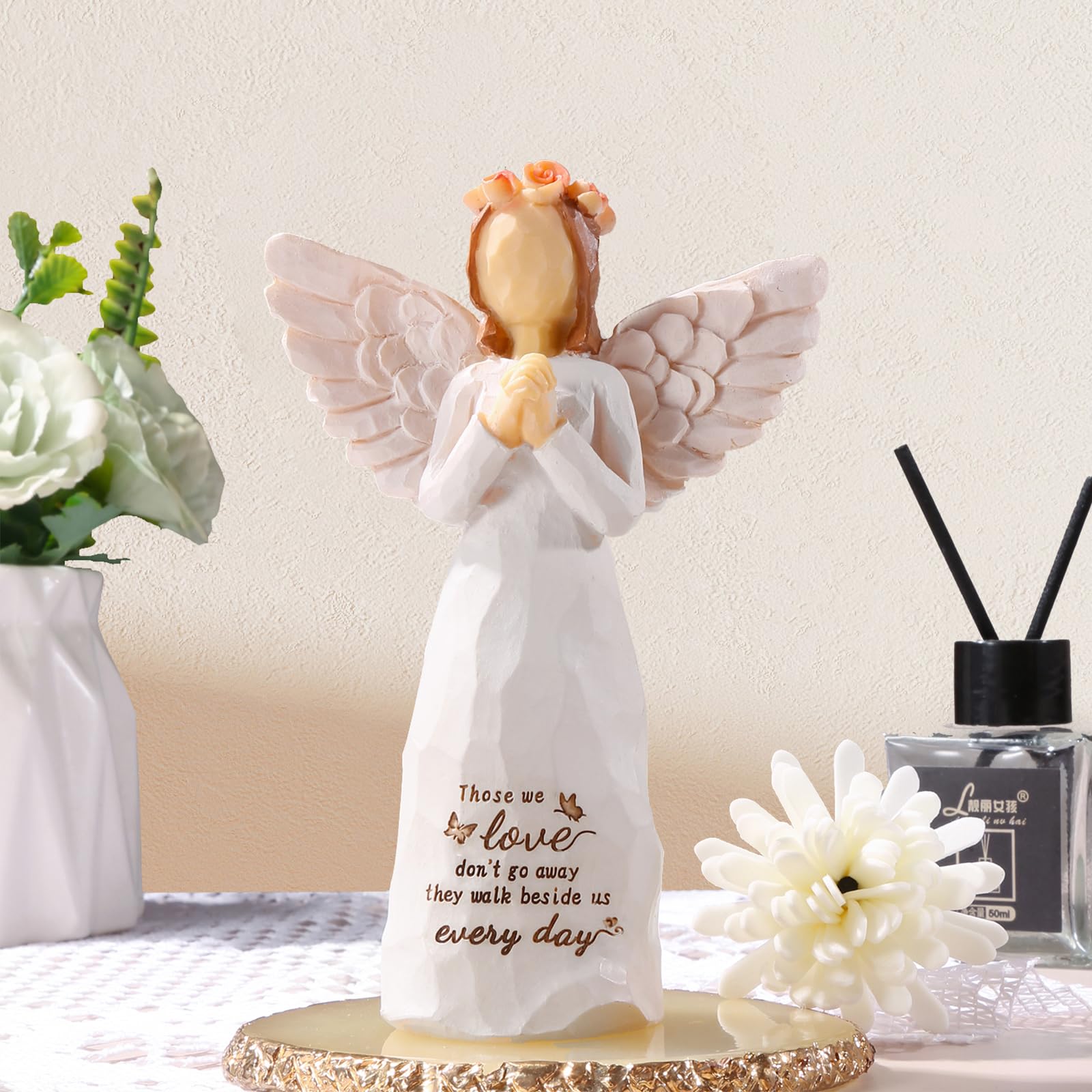 Hand-painted resin angel in cream, a durable keepsake to cherish.
