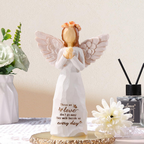 Hand-painted resin angel in cream, a durable keepsake to cherish.