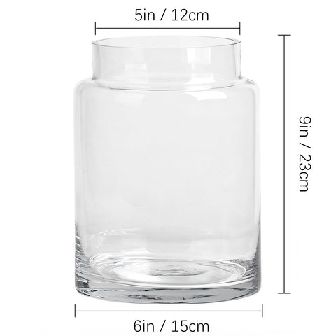 KOIUEYW clear vase in living room creates calm ambiance with flower arrangements.