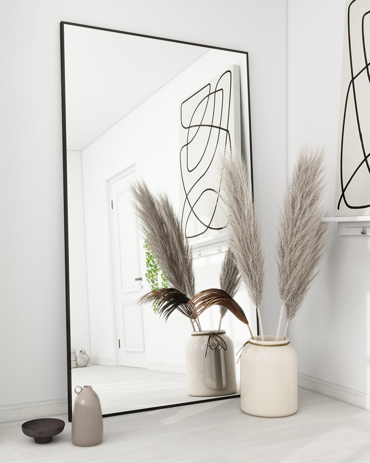 Koonmi full-length floor mirror with stand offers stable, versatile view for full-body checks.