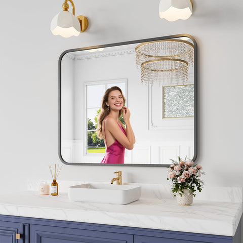 Koonmi bathroom mirror with black frame over sink for clear grooming sessions.