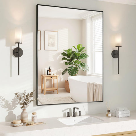 Koonmi black 24x36 inch mirror mounted horizontally above a bathroom vanity