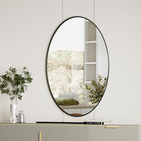 Koonmi black oval bathroom mirror 20x28 with crisp, distortion-free reflection.