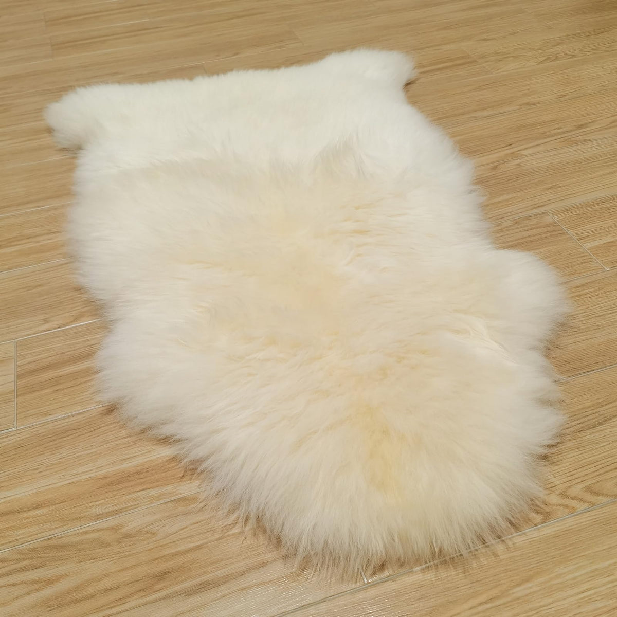 Kopal genuine Australian sheepskin rug natural white close-up, plush warmth for floors.