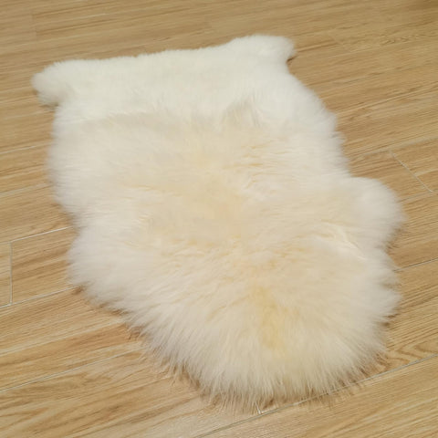 Kopal genuine Australian sheepskin rug natural white close-up, plush warmth for floors.