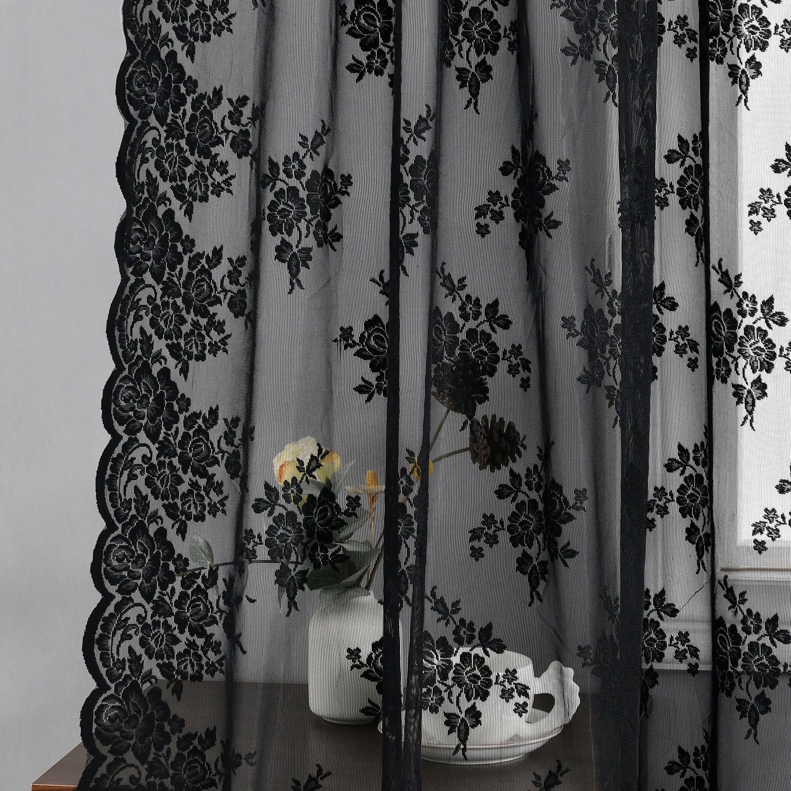 Kotile black lace curtains showcase rich texture and drape, adding depth to any room.