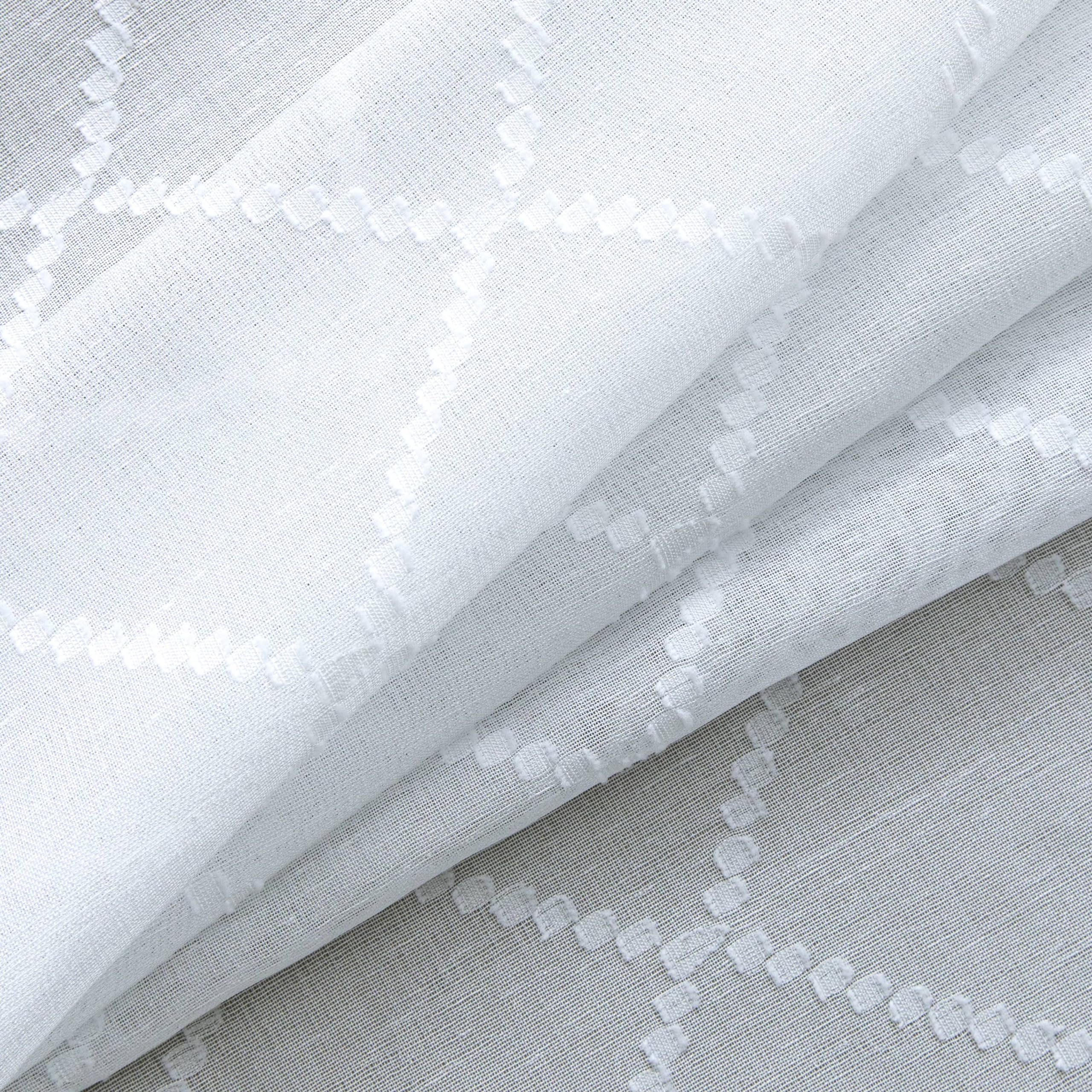 KOUFALL two-panel sheer curtain set with 8 grommets for easy mounting.