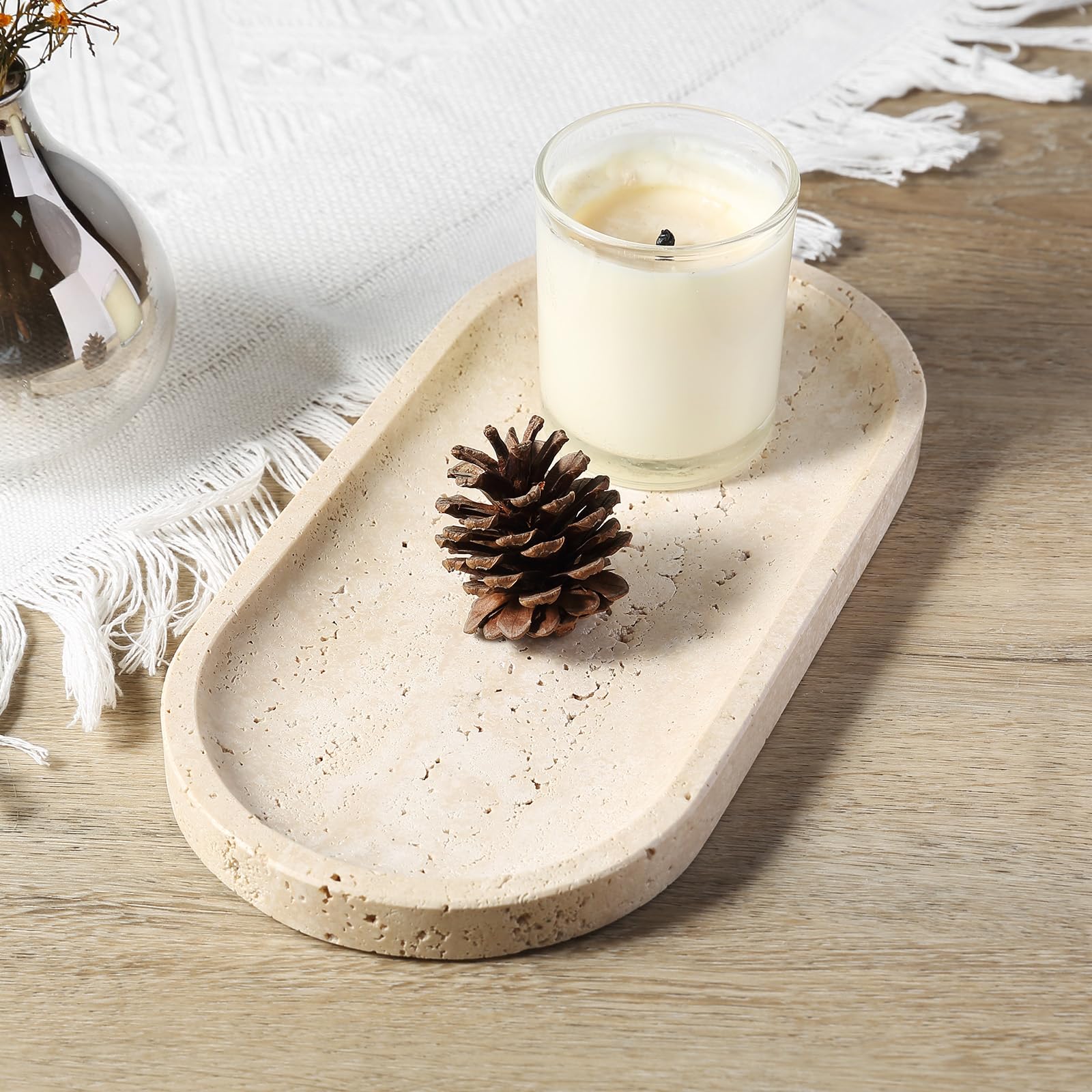 Koville travertine tray soap dish on sink edge.