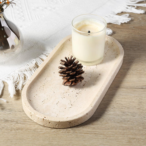 Koville travertine tray soap dish on sink edge.