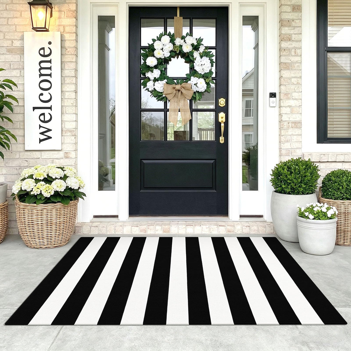 KOZYFLY black and white striped area rug enhances entryway curb appeal