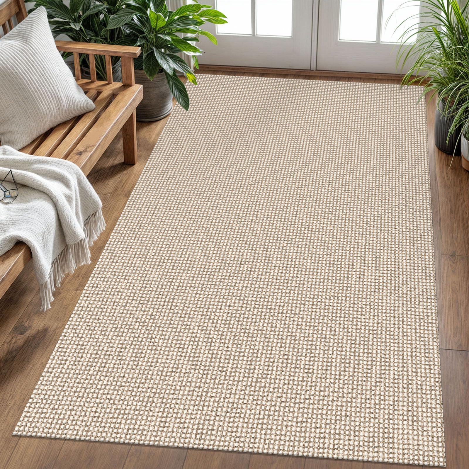 KOZYFLY ivory and khaki braided rug in a living room provides soft, neutral backdrop.